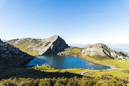 body of water surrounded by hills thumbnail