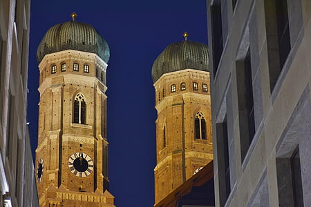 brown concrete tower at night time thumbnail