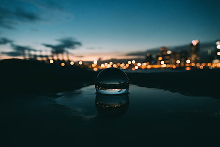 bokeh photography with bubble on water during sunset thumbnail
