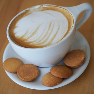 white teacup on white plate thumbnail