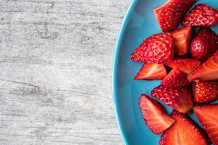 sliced strawberries on blue ceramic plate thumbnail