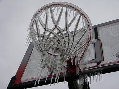 closeup photo of red and black basketball system with icicles thumbnail
