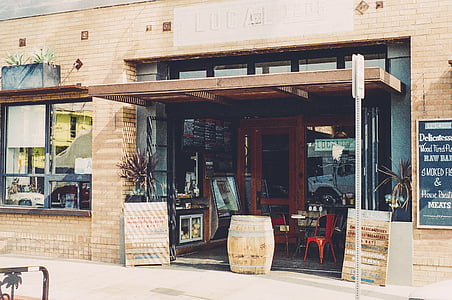 brown wooden barrel in front of store thumbnail