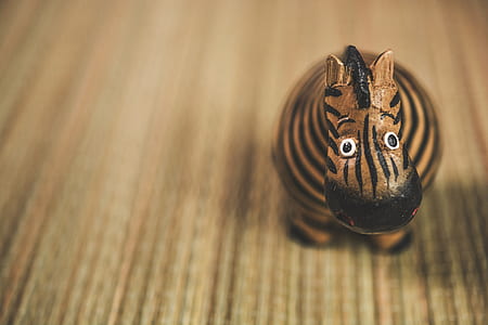 brown and black zebra figurine thumbnail