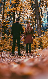 man and woman holding hands thumbnail