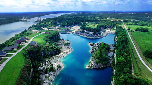 aerial photography of body of water under blue sky thumbnail