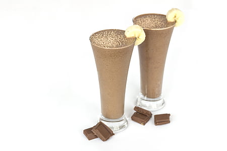 two chocolate shakes with sliced of bananas thumbnail