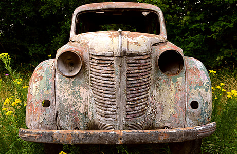 rusted classic vehicle on grass field thumbnail