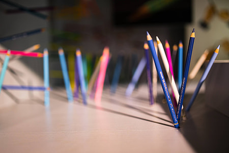 Pencils and crayons sticking out of the walls and floors thumbnail