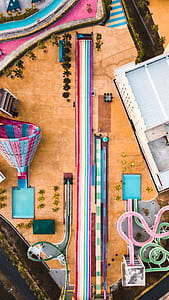 aerial photography of swimming pool strips surrounded with trees during daytime thumbnail