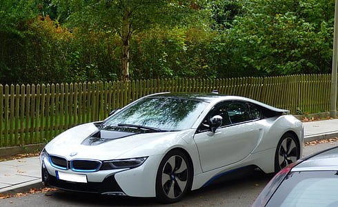 white BMW car on roadway thumbnail
