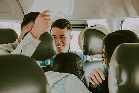 Shallow Photography of Man in Green Top Inside Vehicle thumbnail