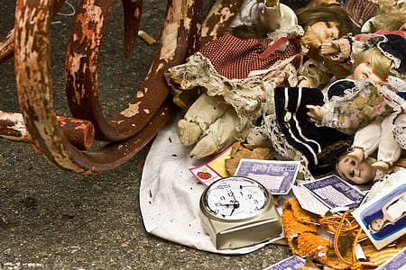 dolls beside wheel thumbnail