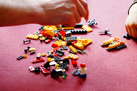 person and child playing LEGO blocks thumbnail