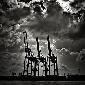 silhouette of three container crane thumbnail