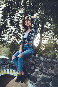 woman sitting on bridge thumbnail