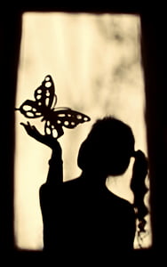 woman holding butterfly sand art thumbnail