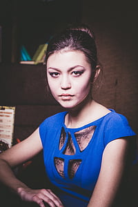 woman sitting beside table thumbnail