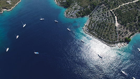 aerial photography of boats on body of water thumbnail