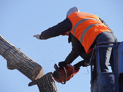 man holding red chainsaw thumbnail