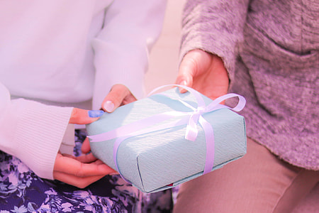 two Person holding a blue gift box thumbnail