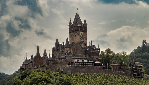 brown castle under gray clouds thumbnail