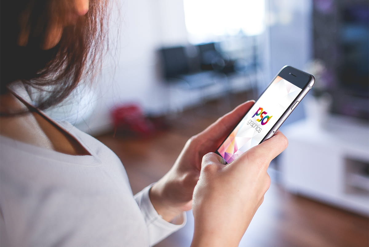 Holding iPhone in Hand Mockup PSD psd file
