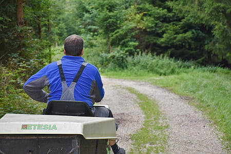 man riding ride-on mower thumbnail