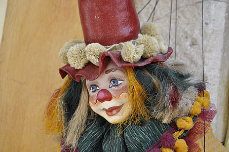 red and yellow clown figurine thumbnail