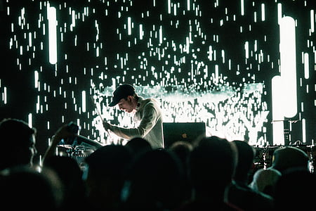 DJ playing music wearing cap thumbnail