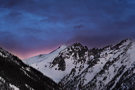 snow capped mountains at dusk thumbnail