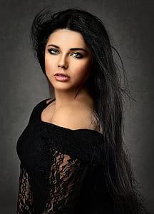 woman wearing black floral dress thumbnail
