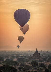 five assorted-color hot air balloons thumbnail