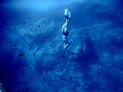 woman diving under body of water thumbnail