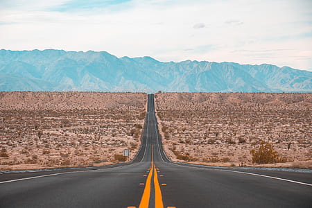 photo of gray concrete pavement heading mountain thumbnail