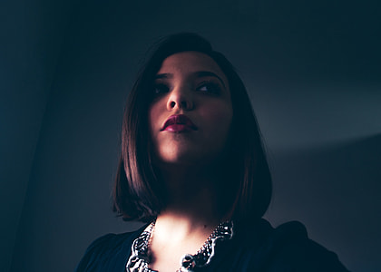 woman wearing black and white scoop-neck shirt thumbnail