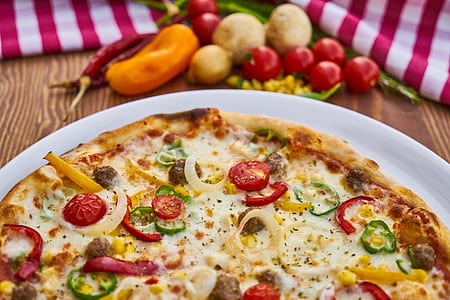 brown crusted pizza on top of white plate thumbnail