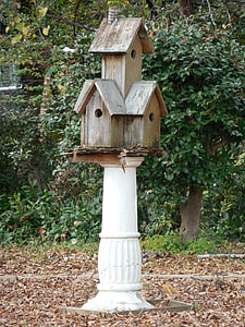 brown wooden birdhouse on stsand thumbnail