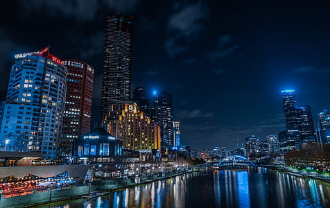 photography of high-rise buildings during nighttime thumbnail