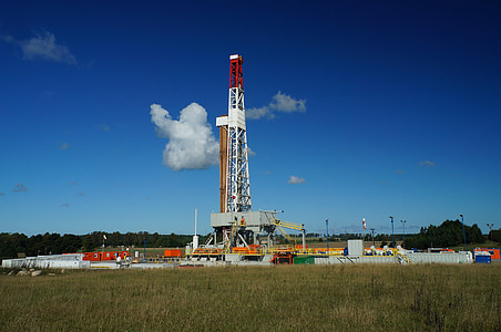 white and red metal tower under blue sky thumbnail
