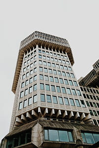 low angle photography of concrete building at daytime thumbnail