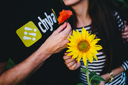 Young couple with sunflower thumbnail