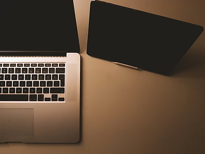 gray laptop computer beside tablet computer thumbnail