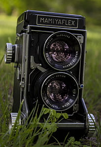 Closeup of Mamiya Flex Twin-lens Camera on Grass thumbnail