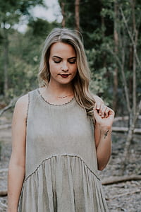 woman standing near tree thumbnail