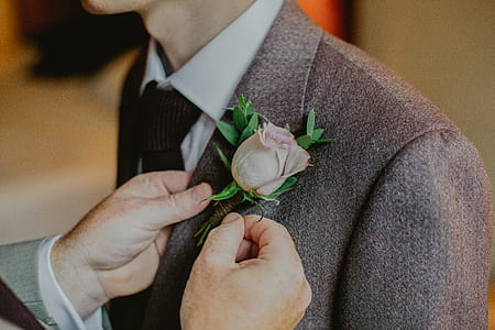 man holding brown blazer thumbnail
