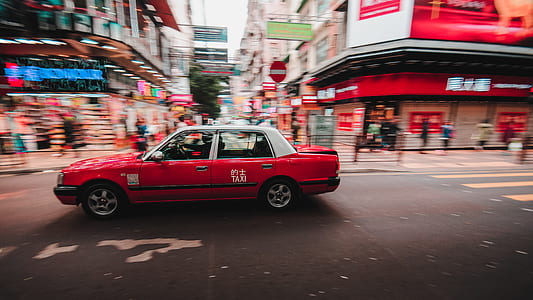 red sedan on road thumbnail