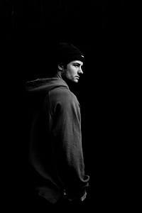 grayscale photo of man wearing knit cap and hoodie thumbnail