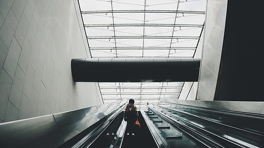 person riding escalator thumbnail