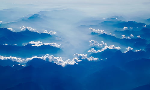 fog covered silhouette of mountain thumbnail
